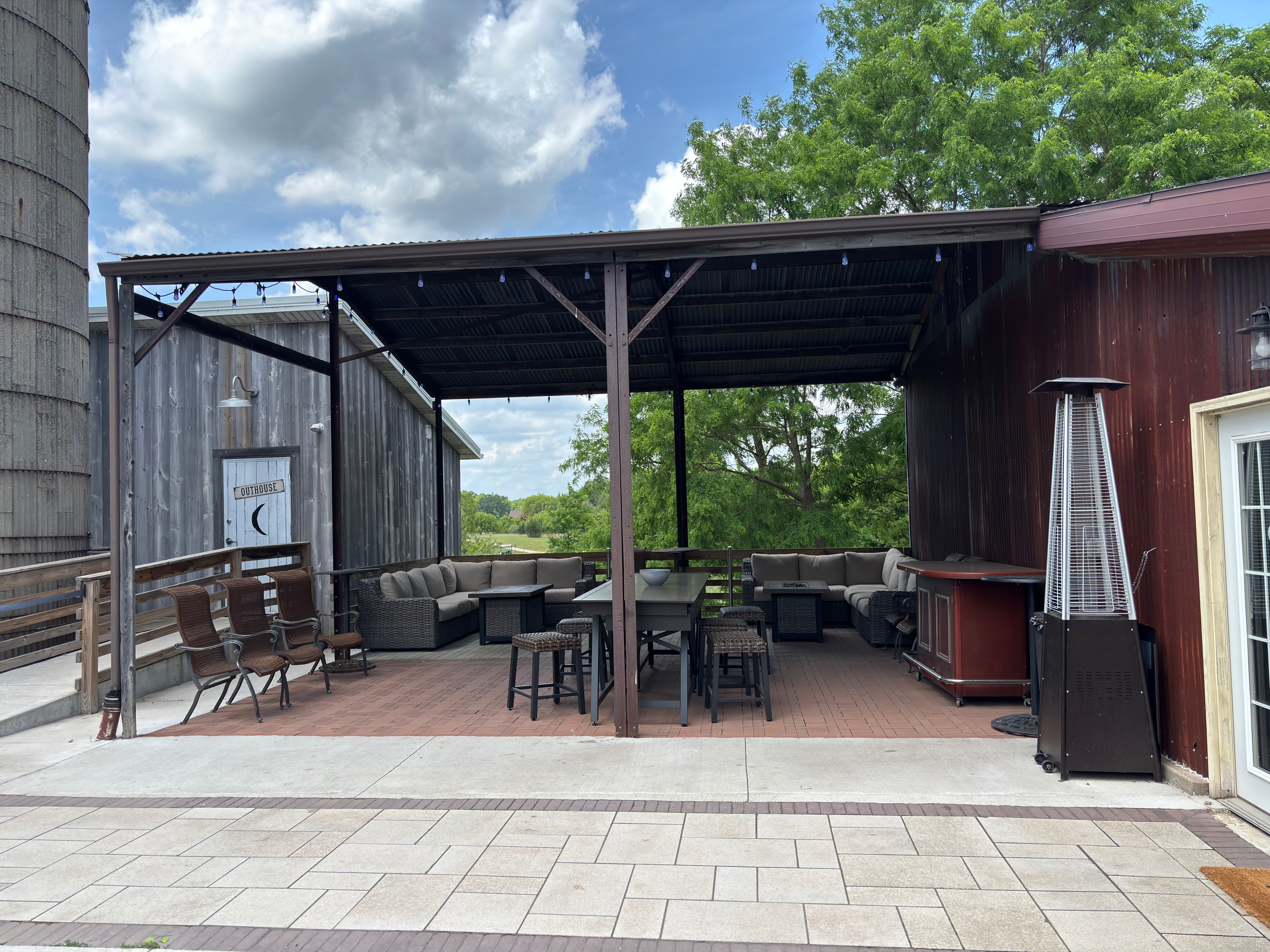 Cocktail area and outdoor setup with seating and decor